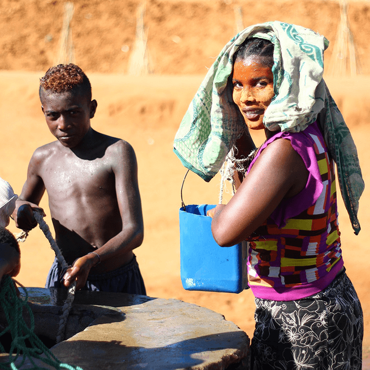 African woman water well